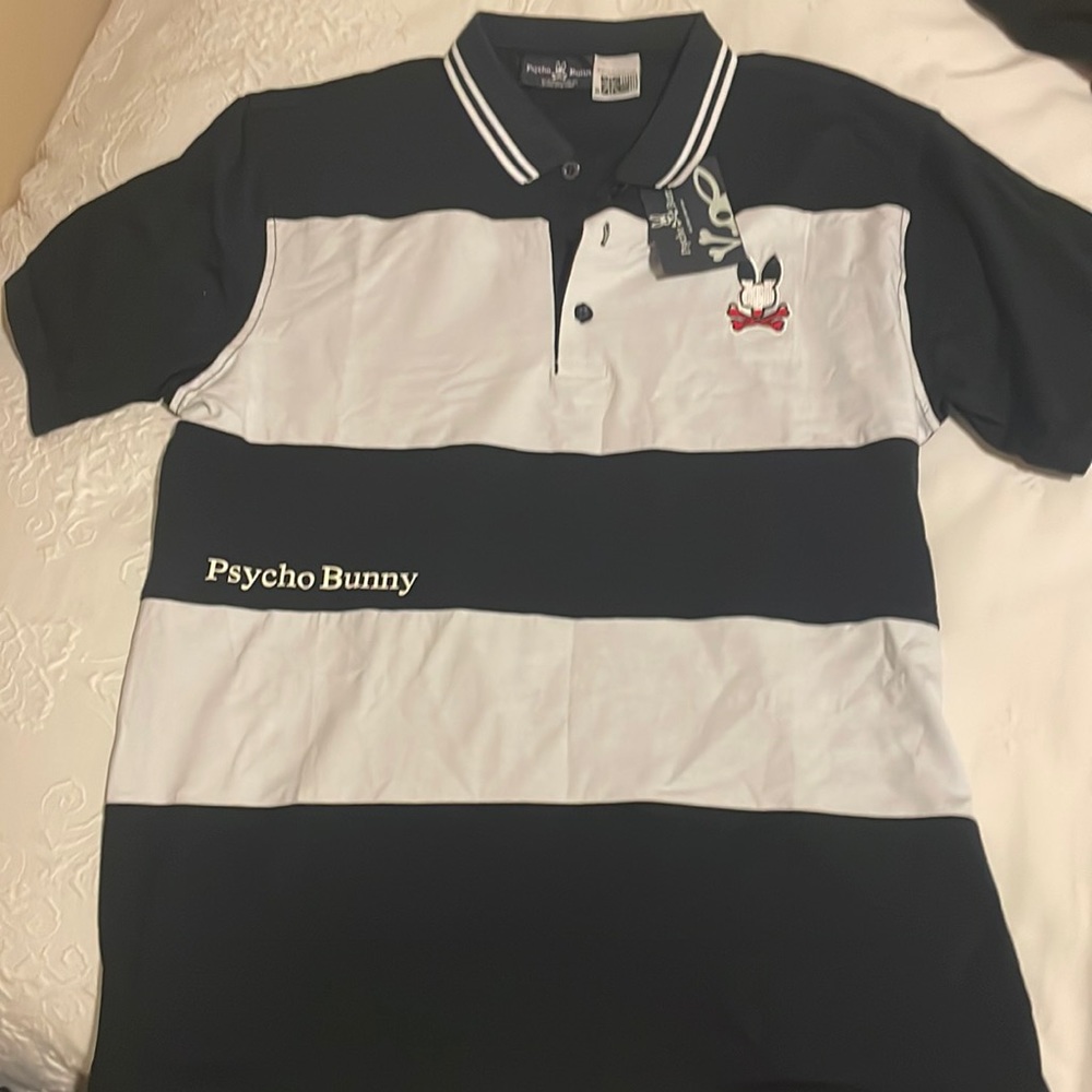 Navy and white striped polo shirt from Psycho Bunny.